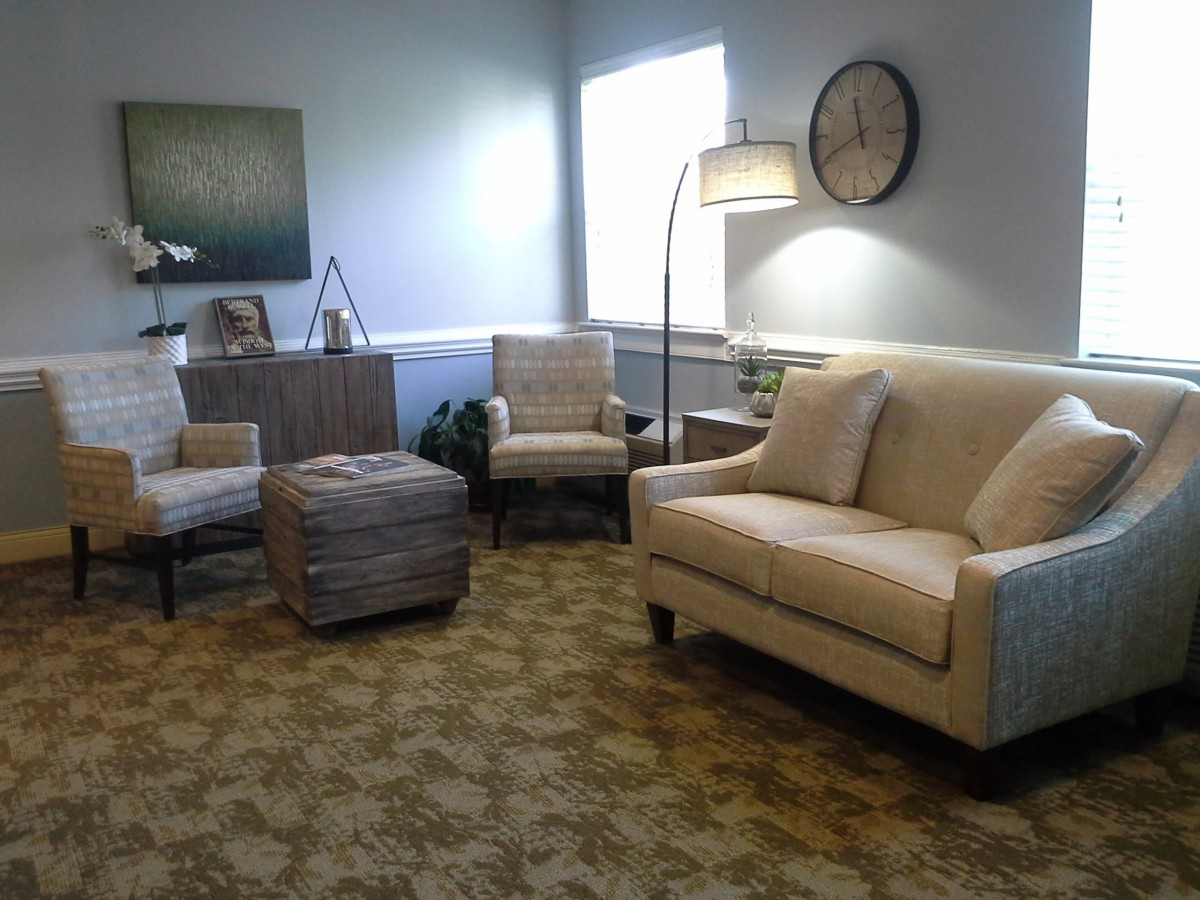 A cozy living room with comfortable seating and a warm atmosphere.