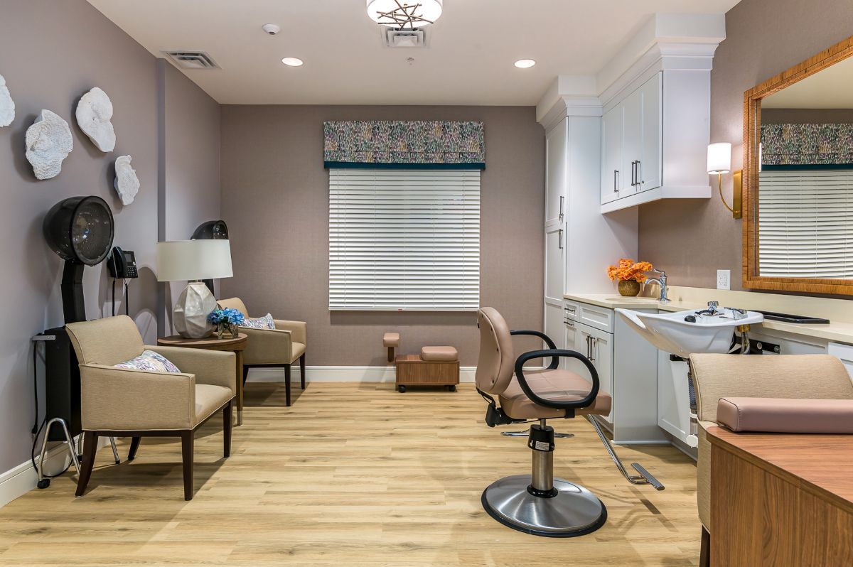 A modern hair salon with stylish chairs and decor.