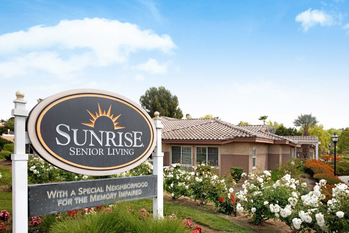 Sunrise Senior Living facility with a landscaped garden.