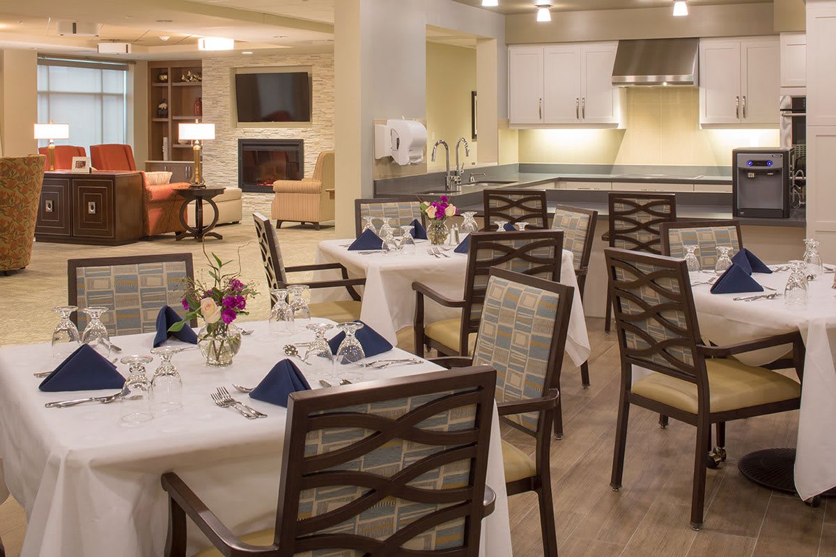A modern dining area with elegantly set tables and contemporary decor.