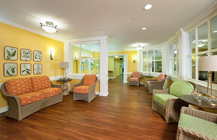 A bright and cozy living room with comfortable seating and warm lighting.
