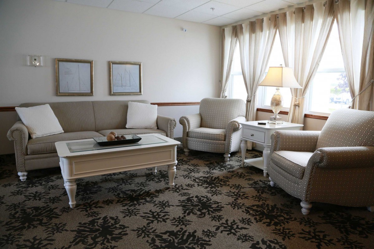 A cozy and elegantly decorated living room with comfortable seating and soft lighting.