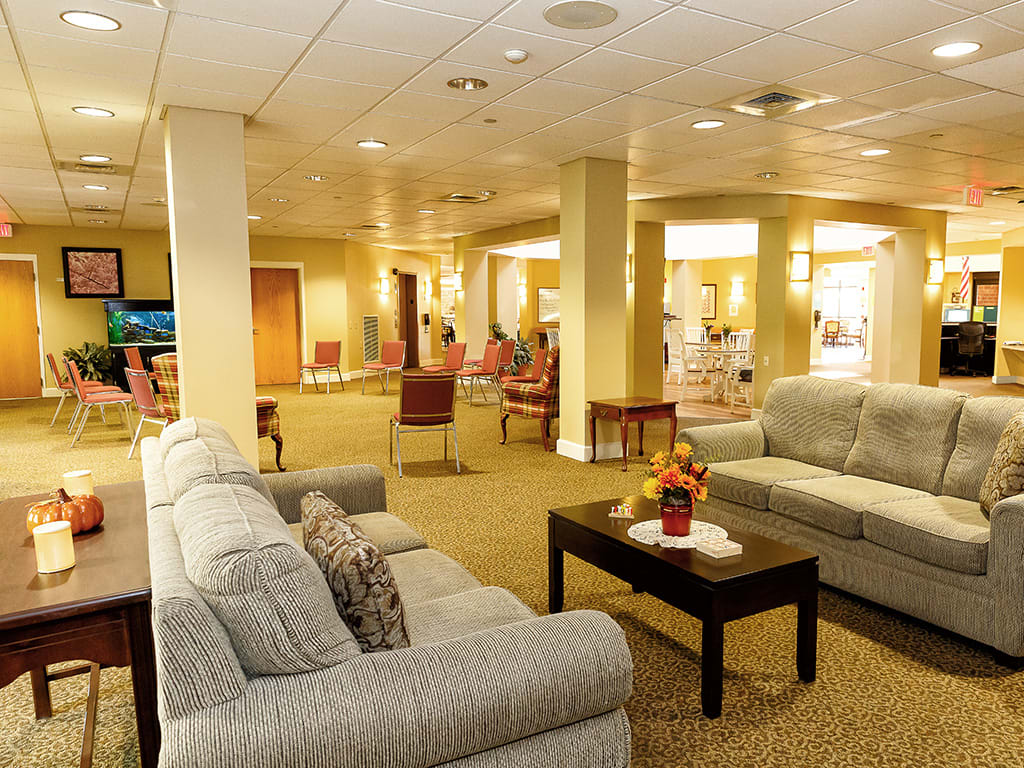 A cozy lobby with comfortable seating and warm lighting.
