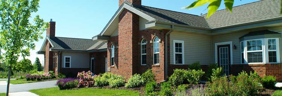 A charming brick house with a well-maintained garden.