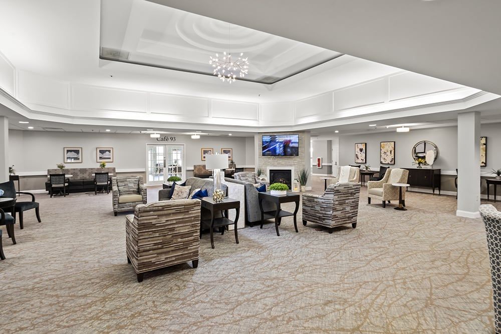 A spacious and modern lounge area with comfortable seating and light decor.