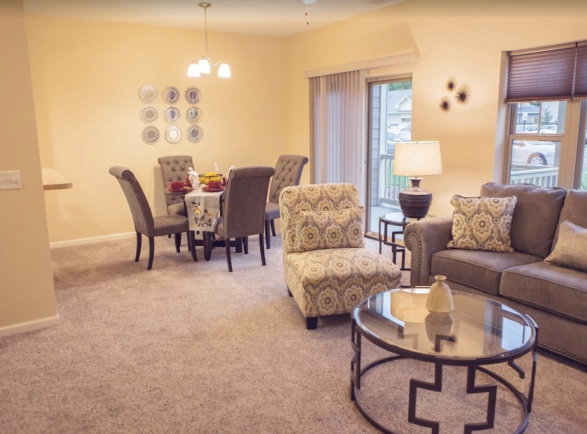 A cozy living room with an elegant dining area and stylish furniture.