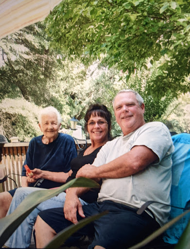A joyful family gathering in a serene outdoor setting.