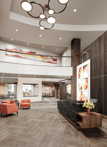 A modern lobby area with stylish furniture and contemporary artwork.