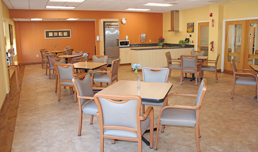 A cozy dining area featuring modern furniture and a warm color palette.