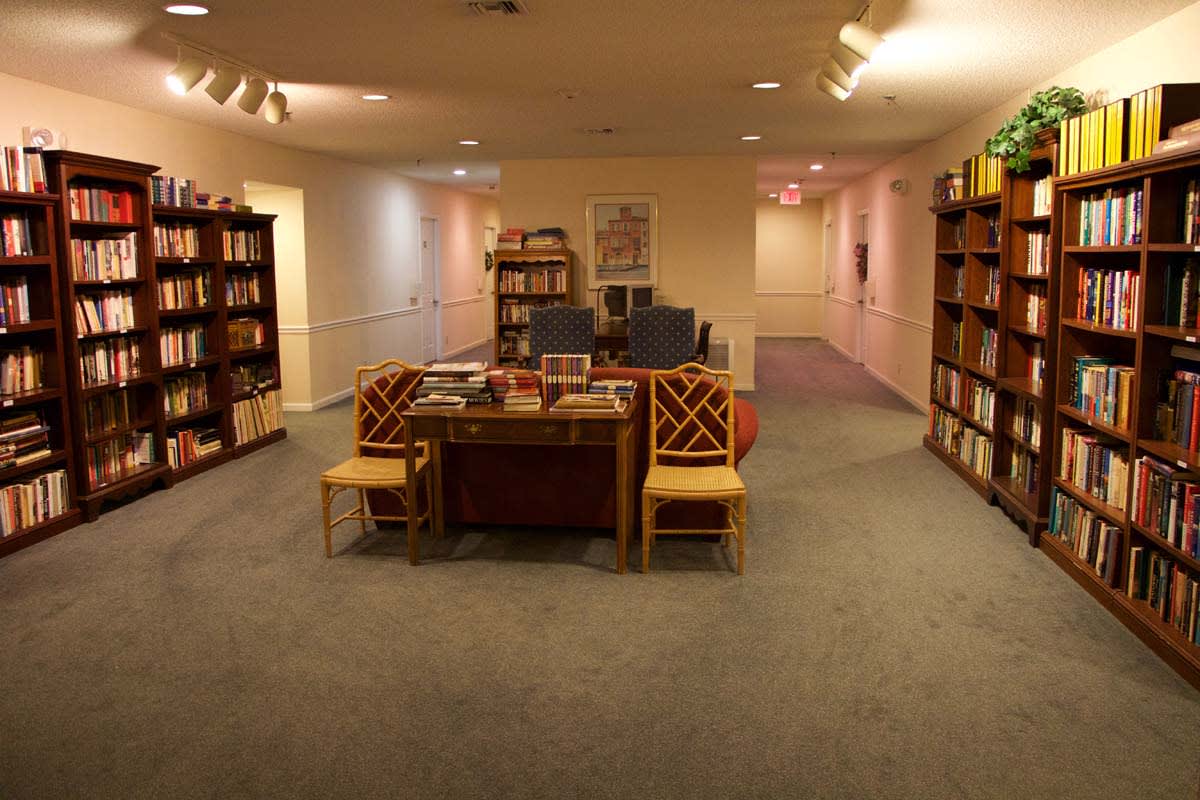 Cozy library interior with bookshelves and a reading area.