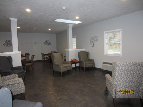 A spacious seating area with comfortable chairs and modern decor.