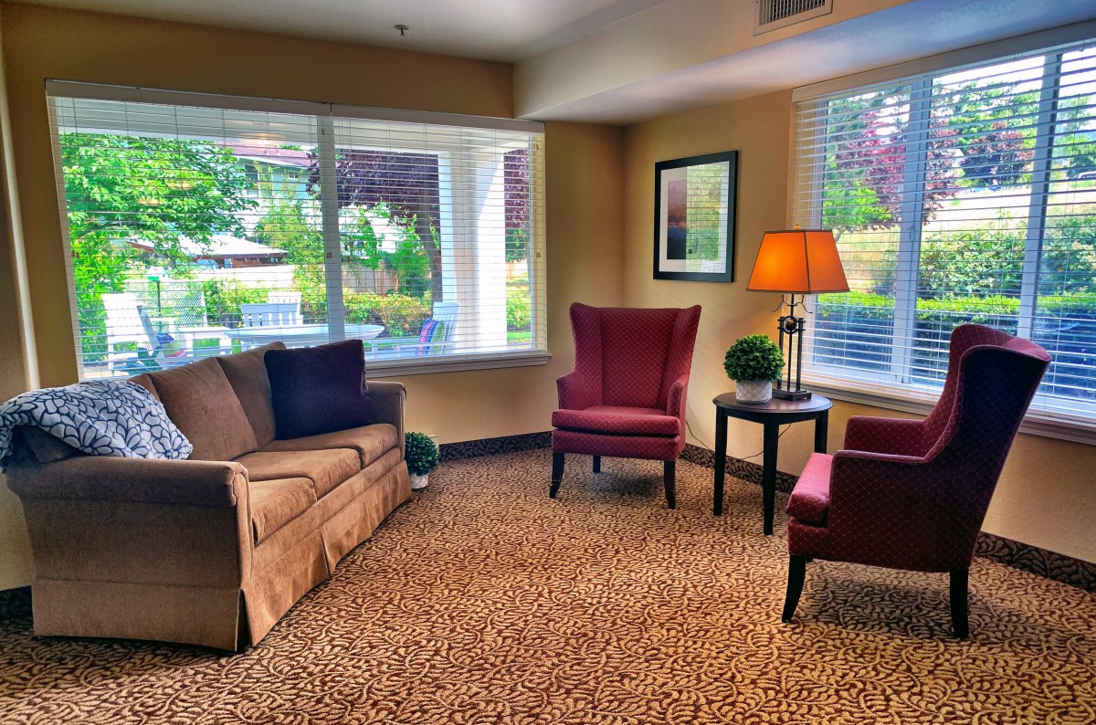 A cozy living room with comfortable seating and a warm atmosphere.