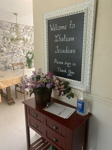A warm welcome awaits with a chalkboard sign and a floral arrangement.