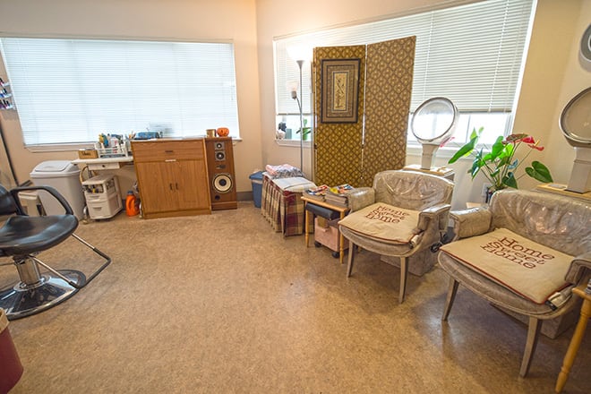 A cozy living room with vintage furniture and decor.