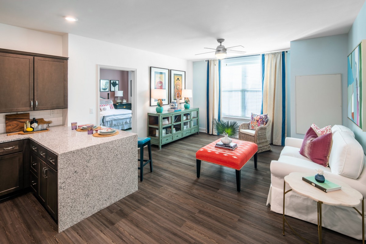 A modern living room with colorful accents and stylish furniture.