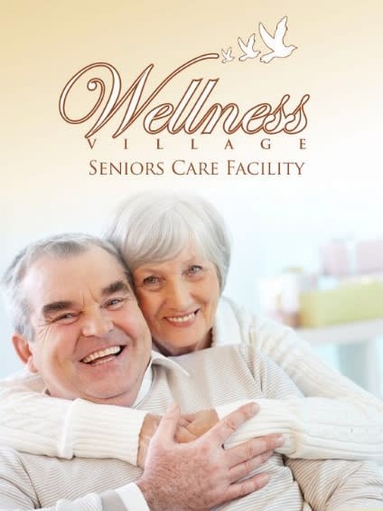 Elderly couple smiling at a wellness village seniors care facility.