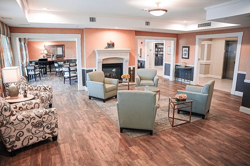 A cozy living room with comfortable seating and a fireplace.