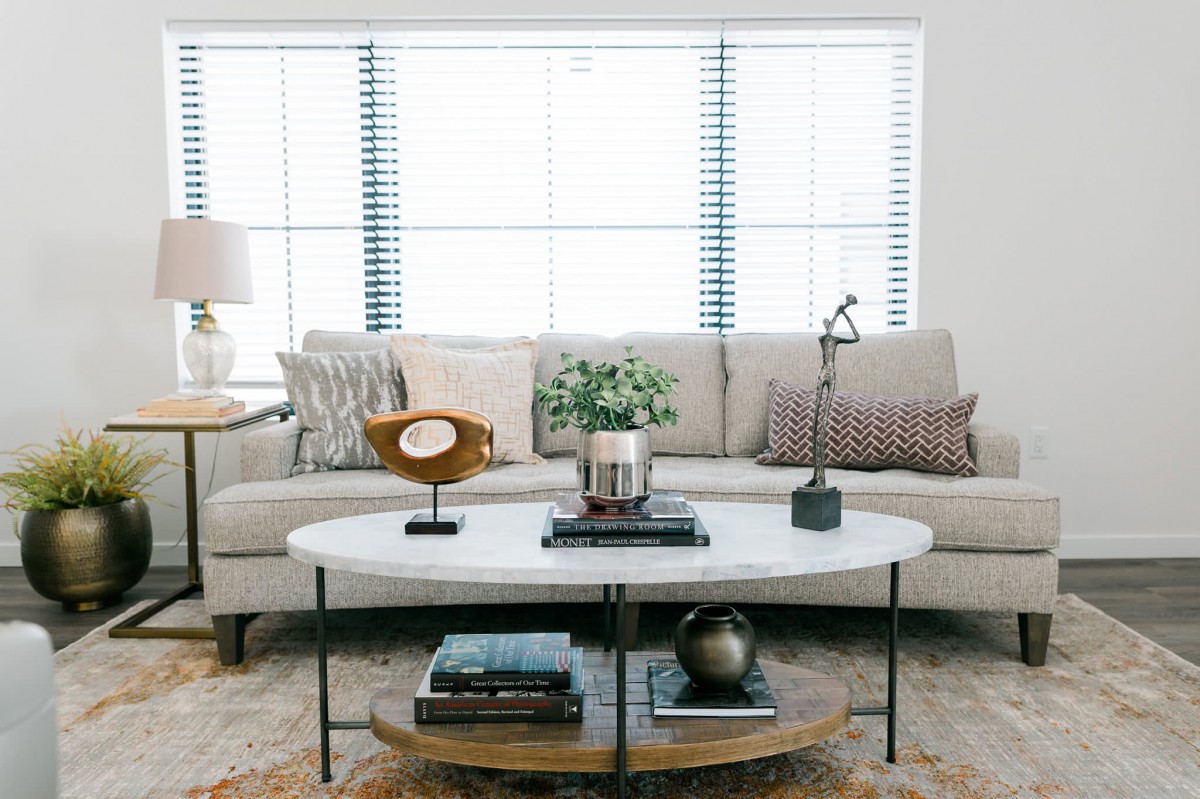 A modern living room with a comfortable sofa and stylish coffee table.