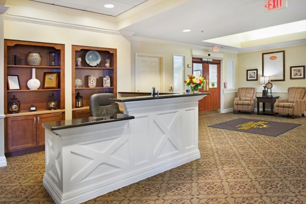 A welcoming lobby with a reception desk and seating area.