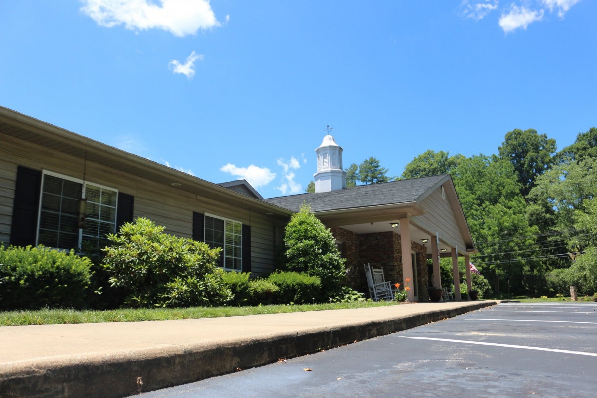 A picturesque view of a church building under a clear blue sky.