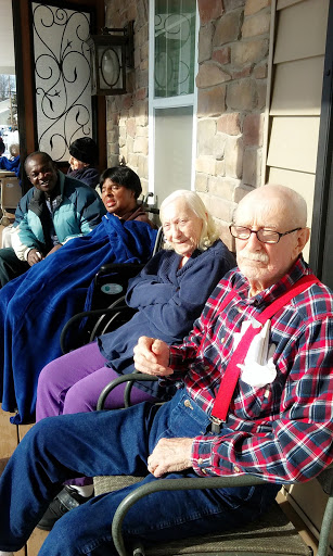 A group of seniors enjoying the sunshine together outdoors.