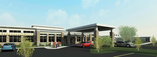 A modern architectural design featuring a welcoming entrance with landscaped surroundings.