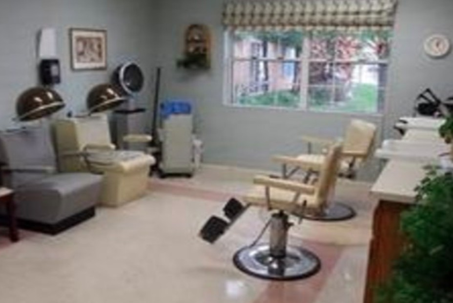 A cozy beauty salon with barber chairs and hair styling equipment.