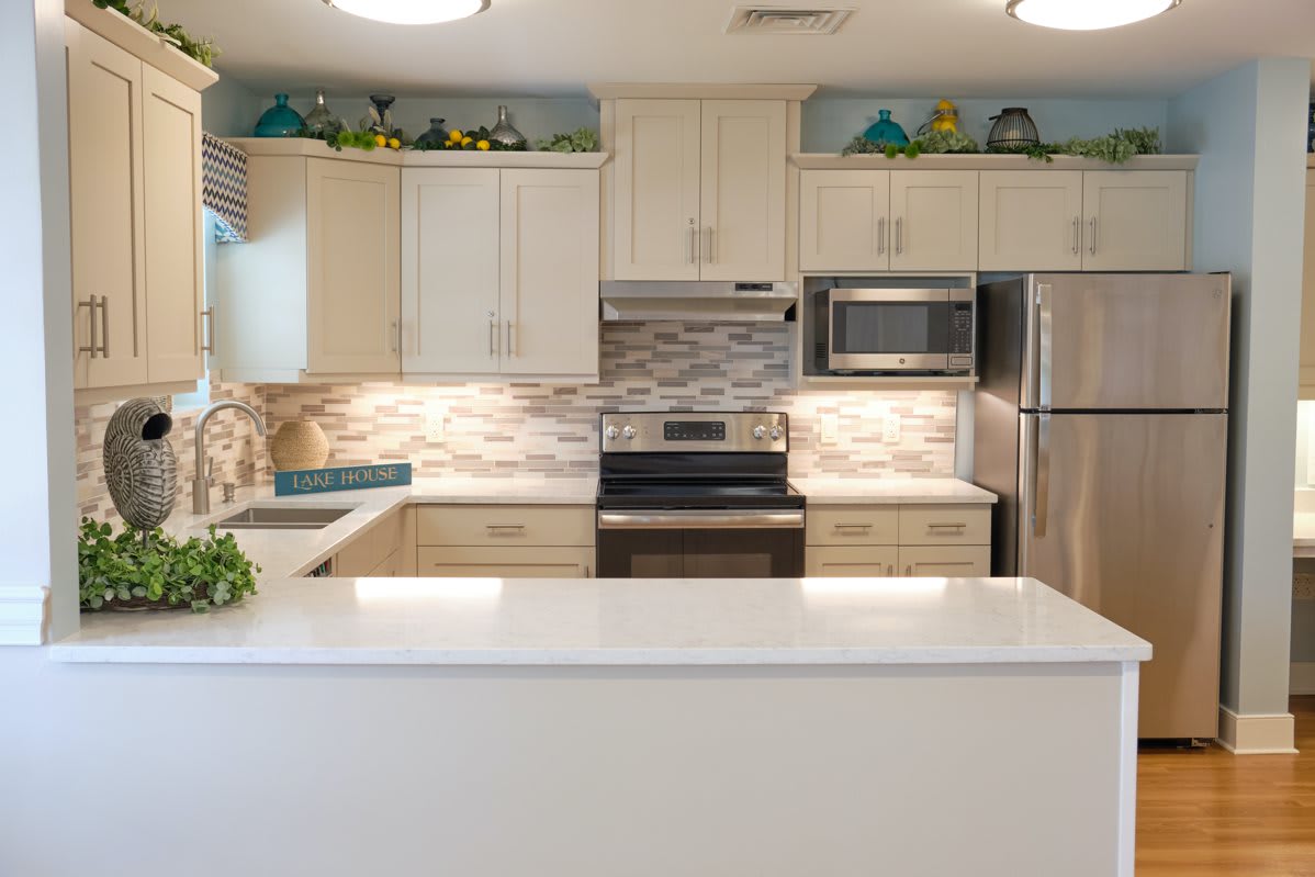 A modern kitchen with stainless steel appliances and a sleek countertop.