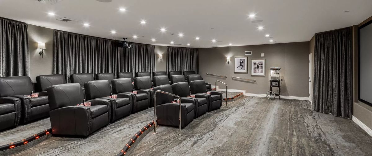 A luxurious home theater with comfortable seating and elegant design.