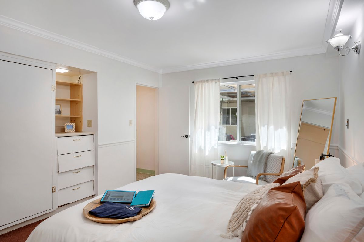 A bright and cozy bedroom with modern decor and natural light.