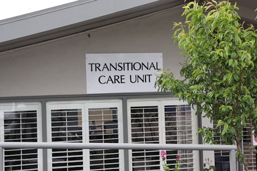 Exterior view of a Transitional Care Unit, indicating a specialized healthcare facility.