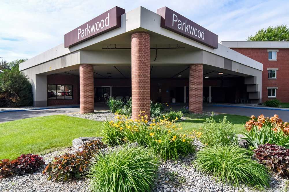 Entrance of a Parkwood building with landscaped garden.
