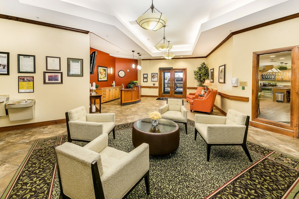 A cozy lobby area with comfortable seating and a reception desk.