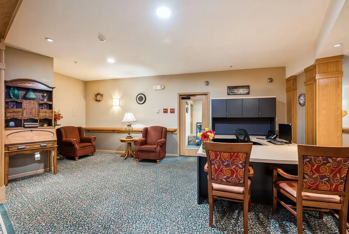 A cozy office interior with comfortable seating and a well-organized desk area.