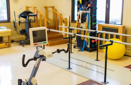 A physical therapy room equipped with specialized exercise tools for rehabilitation.