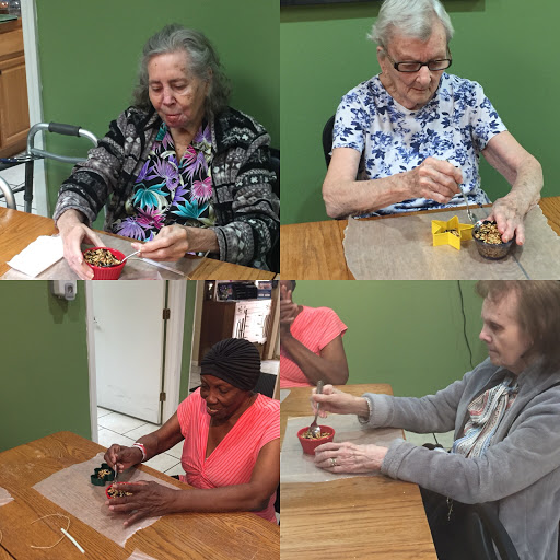 Residents engage in a creative crafting session, fostering interaction and community spirit.