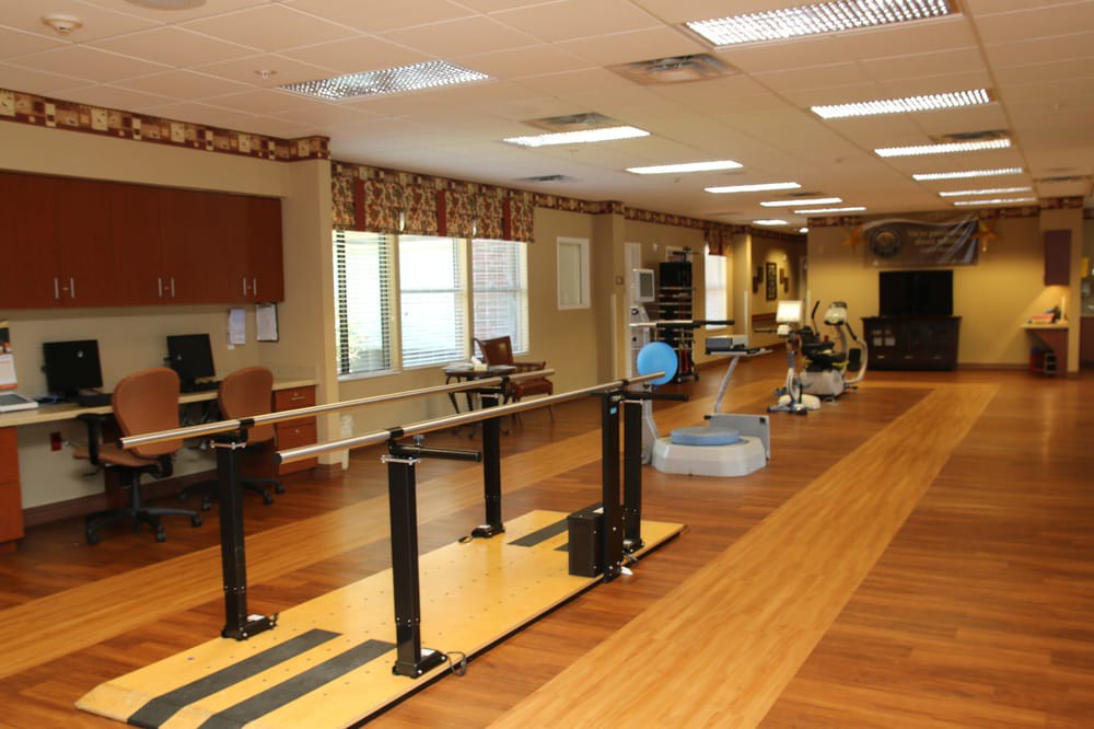 A rehabilitation and physical therapy center equipped with exercise equipment.