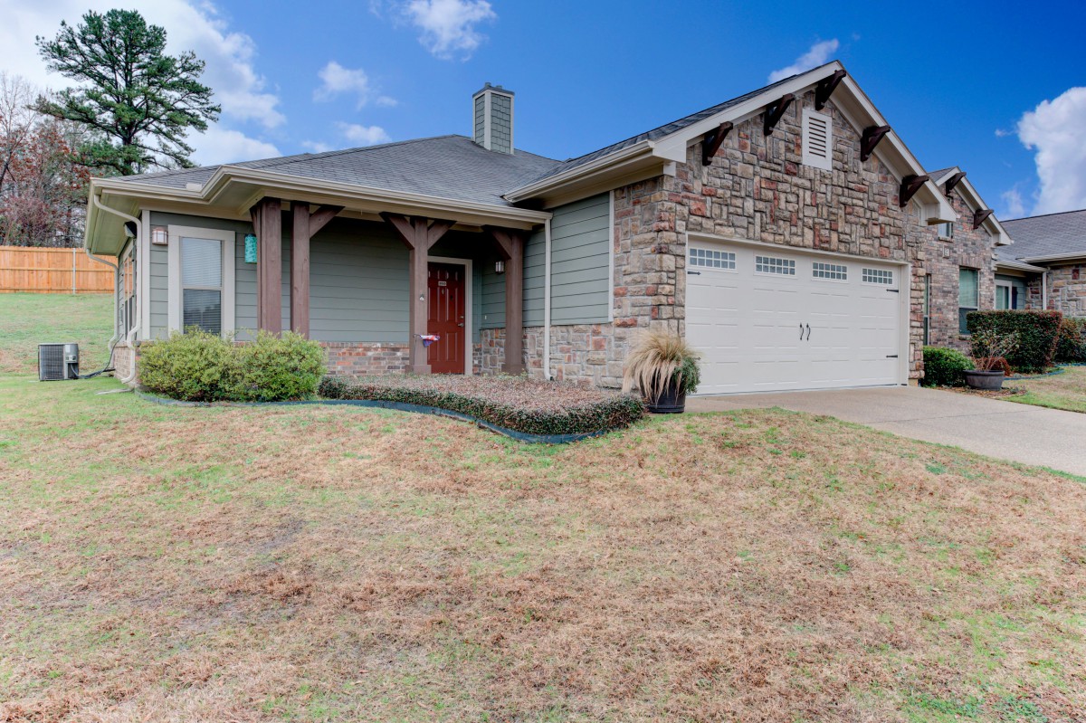 A suburban house with a stone facade and attached garage.