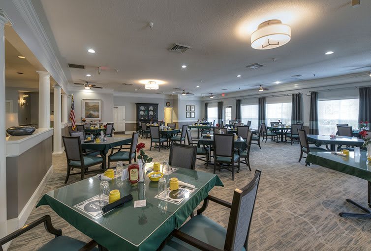 A spacious dining area with neatly arranged tables and comfortable seating.
