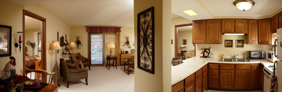A cozy living room and adjacent bedroom with tasteful decor and furniture.