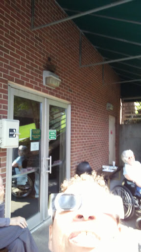 An entrance view of a brick building with doors leading outside.