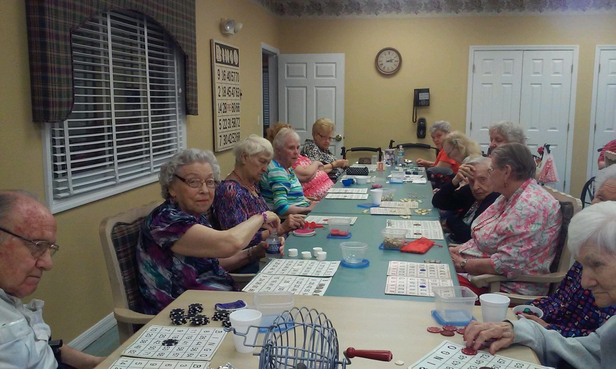 Seniors enjoying a bingo game together in a community setting.