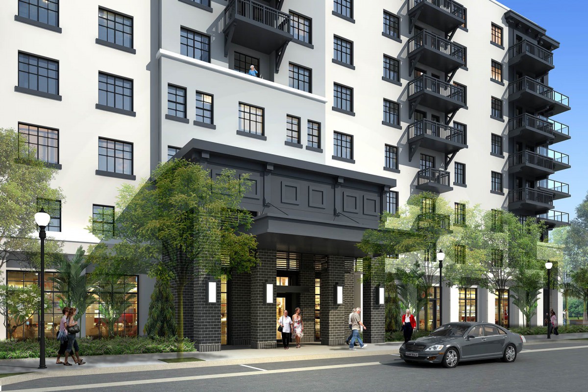 A modern urban apartment building with a sleek exterior and street-level entrance.