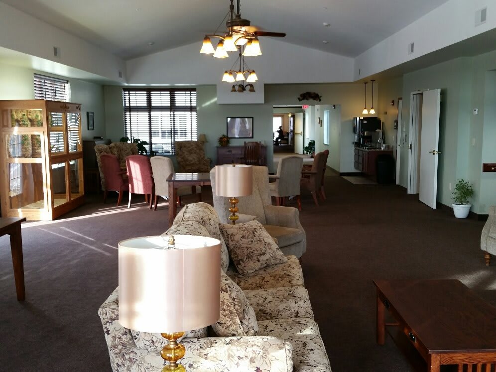 A spacious living room with elegant furniture and ample natural light.