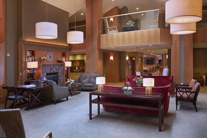 A modern hotel lobby featuring elegant furniture and stylish lighting.