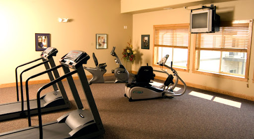 A well-equipped indoor gym featuring various exercise machines for a complete workout.