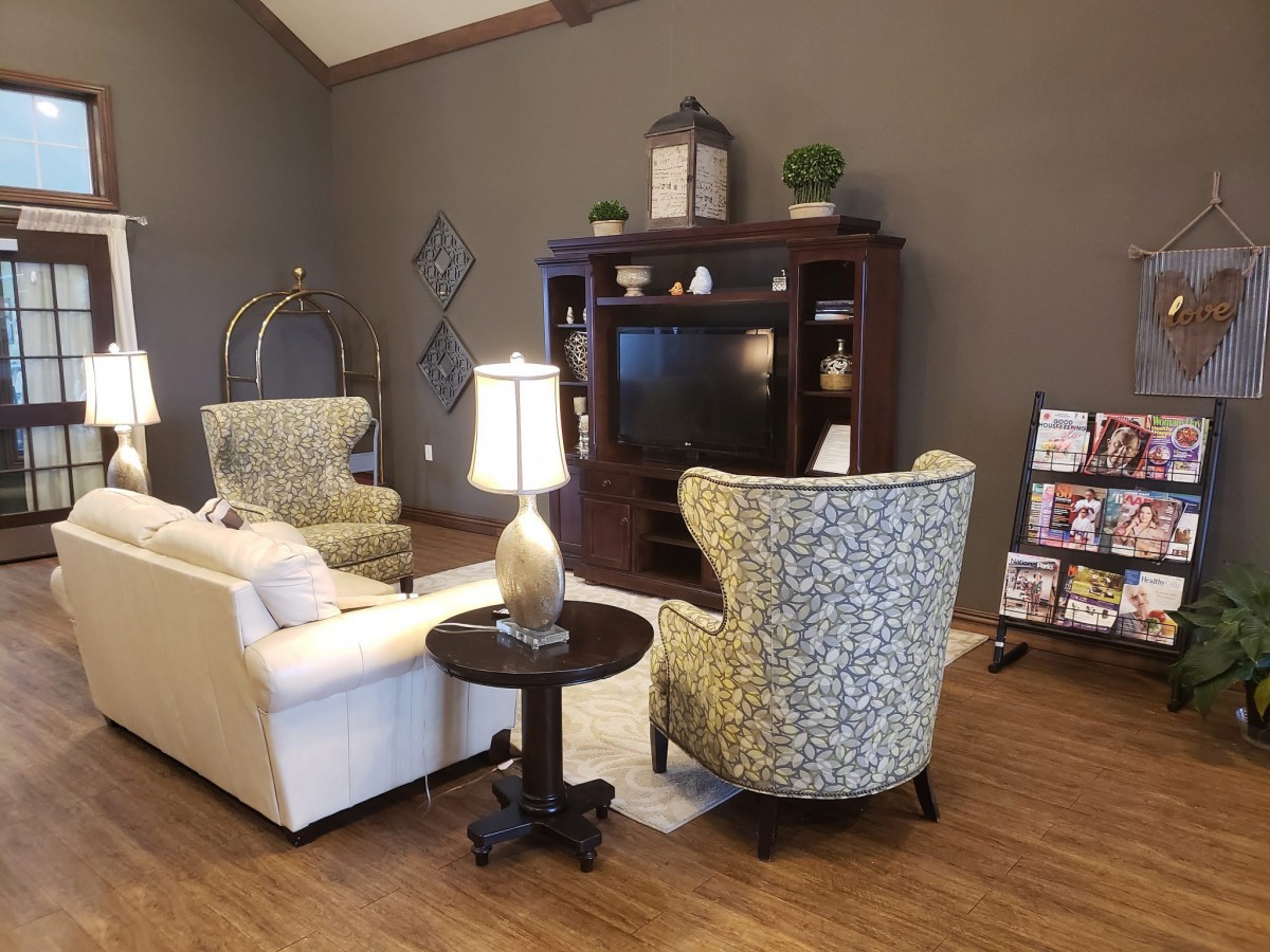 A cozy living room with comfortable seating and a TV entertainment unit.