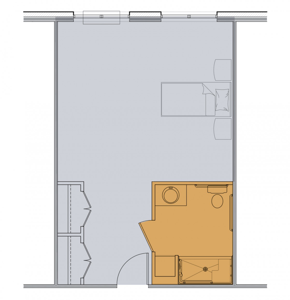 A floor plan with a bathroom layout and open room space.