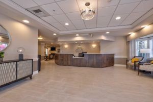 Spacious and modern reception area with a central desk and elegant lighting.