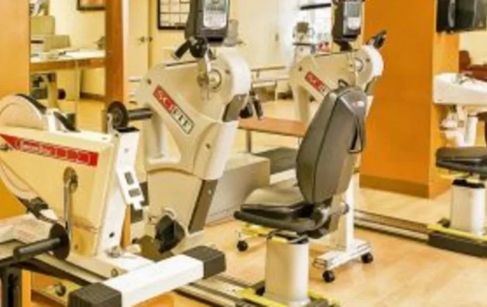 A gym setup featuring exercise equipment designed for cardiovascular workouts.